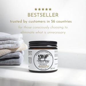 May include: A 60 ml amber glass jar of Beyond Functional Food Tallow Balm with a black lid. The white label features a cow illustration and the text: Tallow Balm, PURE UNSCENTED, GRASS-FED. Five gold stars appear above the text BESTSELLER.
