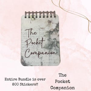 May include: A small, spiral-bound notebook titled "The Pocket Companion." The cover features a floral design with roses and script-style text. The notebook is rectangular with a brown spiral binding.