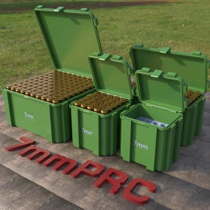 May include: Green plastic ammunition storage containers, some open to reveal brass-colored bullets. The text "7mm" is printed on the containers. The red text "7mm PRC" is in the foreground.