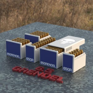 May include: Four white boxes with blue lids filled with gold-colored ammunition. The boxes are labeled "6.5 GRENDEL" and "65GR". The boxes are arranged in a pyramid shape. The top box has a skull and crossbones logo. The boxes are sitting on a camouflage-patterned surface.