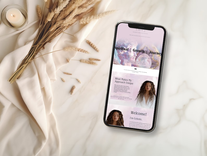 May include: A mobile phone displaying a website for a spiritual growth journey. The website features a pink and purple background with a woman's face and the text "Spiritual | Growth | Journey".