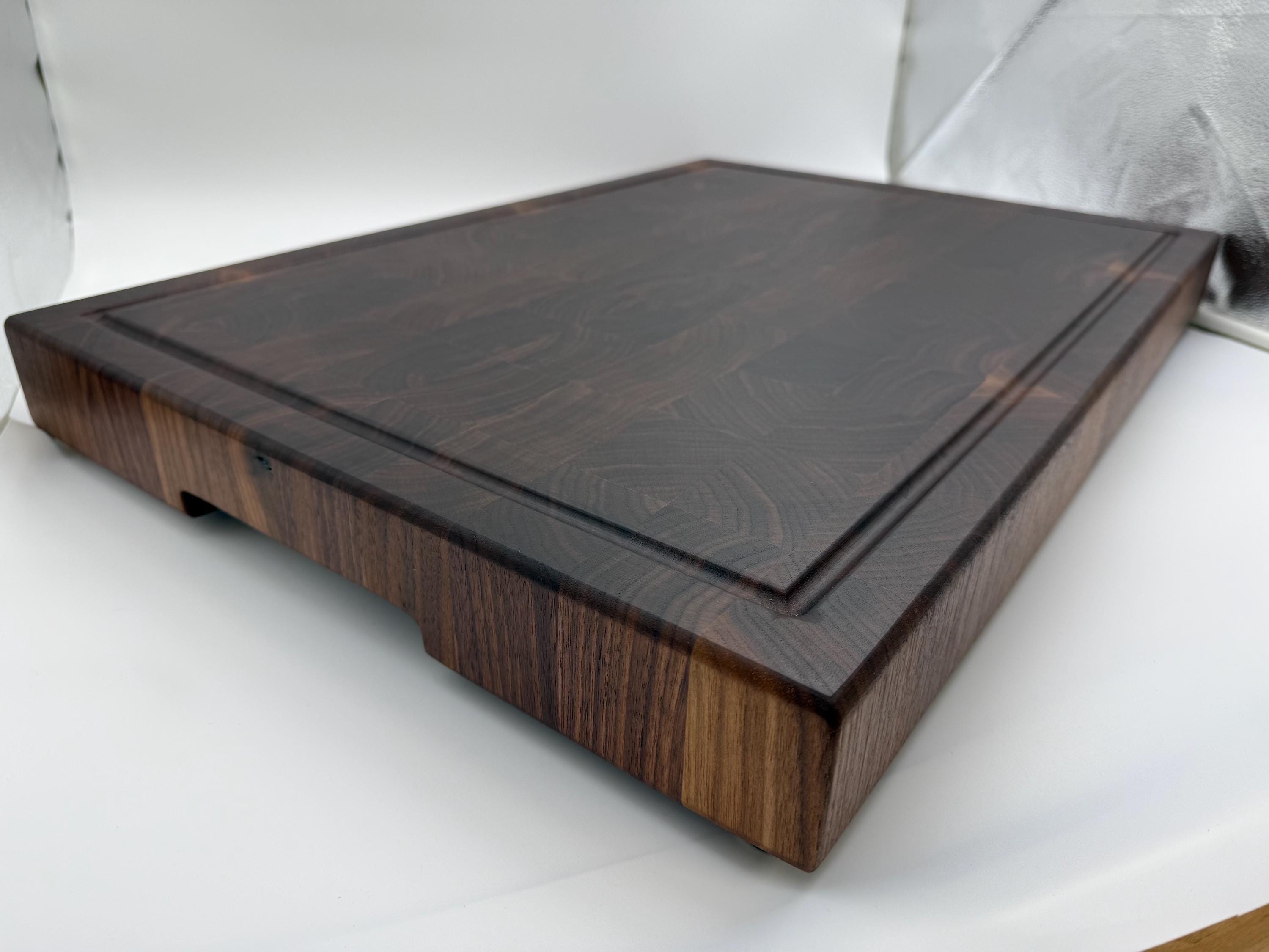 Solid Walnut Butcher Block! With juice groove, handles and brass feet. A great cutting boardfor slicing your BBQ and favorite smoked meats!