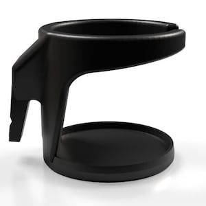 May include: Black plastic cup holder with a wide base and a handle that extends out to the side. The holder is designed to secure a cup or bottle.