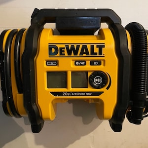 May include: A yellow and black DeWalt 20V lithium ion air compressor with a digital display and controls. The compressor has a hose and a carrying handle.