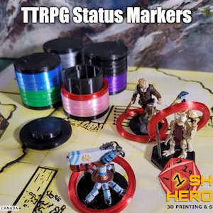 May include: A set of colourful 3D printed status markers for tabletop role-playing games (TTRPG). The markers are stacked in cylinders and feature different colours, including red, pink, blue, green, and purple. The image also shows miniature figures and dice, suggesting the markers are used for tabletop gaming.