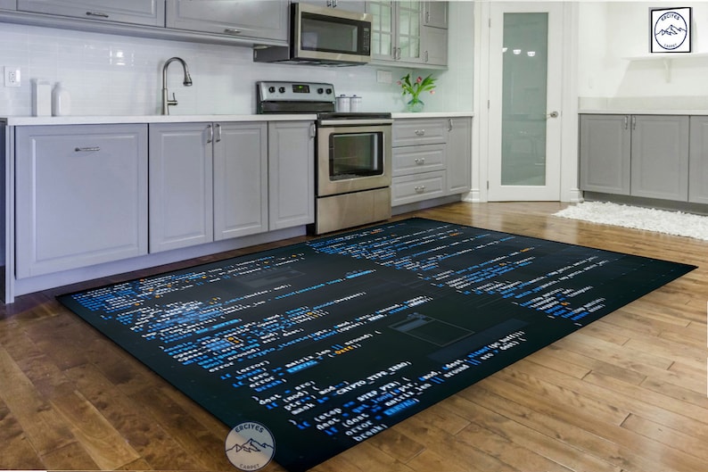 May include: A black and blue rug with code printed on it. The rug is in a kitchen with white cabinets and a stainless steel oven.