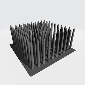 May include: A collection of gray, cylindrical objects with pointed tops, arranged closely together on a dark gray rectangular base. The objects appear to be of varying heights and are set against a white background.