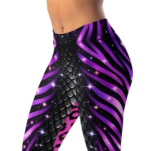 May include: Leggings with a striking design, combining black, purple, and pink patterns. The leggings feature zebra stripes, a snakeskin texture, and a leopard print. Glittering accents enhance the overall visual appeal of the design, creating a bold look.