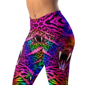 May include: Leggings featuring a vibrant, multi-colored pattern with neon pink, blue, green, and yellow hues. The design incorporates animal print textures, including leopard spots and tiger stripes, overlaid with graphic images of open snake mouths.