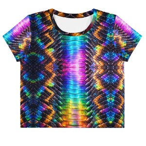 May include: A crop top with a vibrant, multicolored snakeskin pattern. The design features a spectrum of colors, including blue, purple, green, and orange, creating a dazzling effect. The shirt has a white neckline and short sleeves.