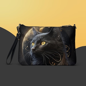 May include: Black clutch with a detailed illustration of a black cat with yellow eyes, set against a celestial background with a moon and stars. The cat has gold accents and a black strap.