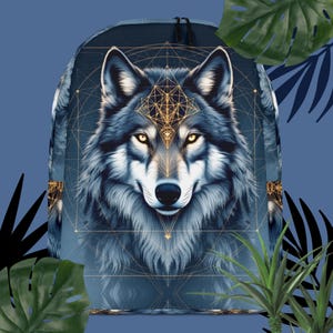 May include: A navy blue backpack featuring a detailed illustration of a wolf's face with golden geometric patterns. The wolf has yellow eyes and a detailed fur design. The backpack has black zippers and a blue background.