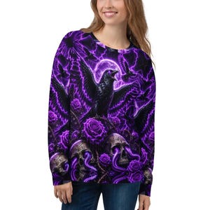 May include: A long-sleeve sweatshirt featuring an all-over print of black ravens, purple roses, and skulls with glowing purple eyes. The background displays a vibrant purple lightning storm and a full moon, creating a high-contrast graphic design.