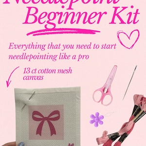 May include: Needlepoint Beginner Kit with 13 ct cotton mesh canvas featuring a pink bow design, pink scissors, a needle, a purple flower-shaped needle threader, and pink embroidery floss skeins. Text reads: Needlepoint Beginner Kit.