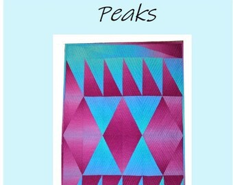 May include: A quilt pattern called "Peaks" designed by Vicki Price Quilts. The pattern features a geometric design with pink and blue triangles.