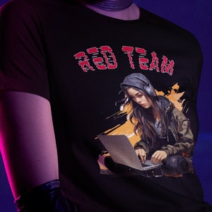 May include: A black t-shirt with a red "RED TEAM" graphic and a stylized image of a woman wearing headphones and using a laptop.