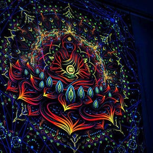 May include: A black tapestry featuring a colourful mandala design. The mandala includes a central figure with a red and yellow lotus flower. The tapestry glows in the dark.