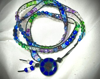 Hombre style Blue/Purple/Green Czech crystal  leather triple-wrap adj. bracelet with blue sodalite & glass button closure.