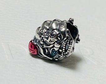 May include: Silver charm with a detailed design of a dragon with red and green accents. The charm has the word "S925" engraved on it.