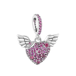 May include: Silver charm with a pink heart with wings. The heart is covered in small pink crystals.
