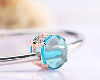 Charm cabujón ovalado azul bañado en oro rosa de PANDORA nuevo con bolsa de regalo