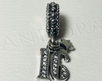 May include: Silver charm with a sparkling crystal-encrusted number "16" and a star charm. The charm is attached to a silver bead with a beaded border.