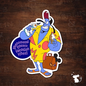 May include: A sticker featuring a blue genie character in a yellow and pink outfit, holding ice cream and a small snowman. The sticker has the text "phenomenal Cosmic Vacation vibes!" on a blue circle, and a brown suitcase.
