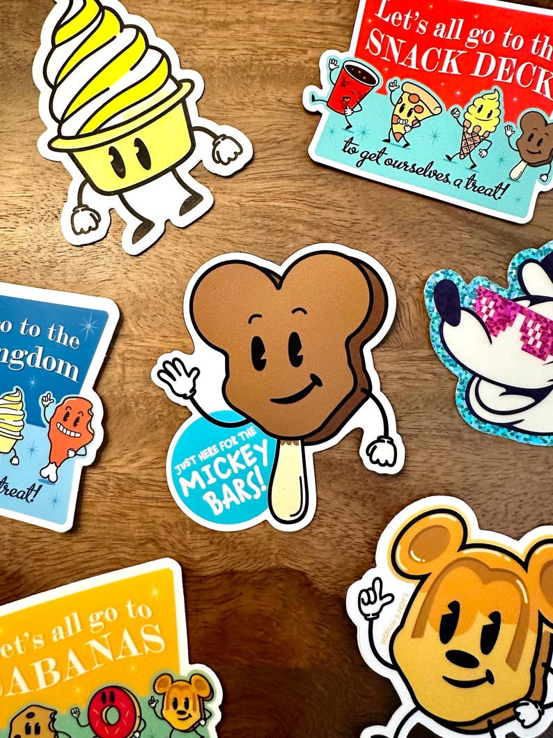 May include: A set of colorful stickers featuring cartoon characters of various foods and drinks. The stickers have a retro style and include phrases like "Let's all go to the Snack Deck" and "Just here for the Mickey Bars!"