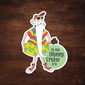 Puede incluir: Una taza de cerámica blanca con un asa negra y el texto "But First, Coffee" en negrita negra. La taza está sobre una superficie de madera. La taza mide 10 cm de alto.