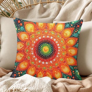 May include: Square decorative pillow with a vibrant mandala design. The pillow features a central circular pattern with concentric rings of orange, yellow, and green. The background is dark blue with small dots, and the pillow is surrounded by neutral-colored pillows.