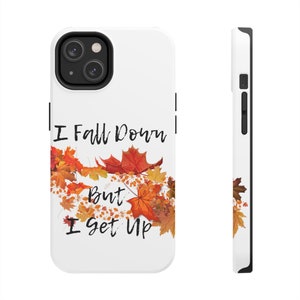 May include: White iPhone case with a fall-themed design. The case features a white background with a design of orange, red, and yellow leaves. The text "I fall down but I get up" is printed in black on the case.
