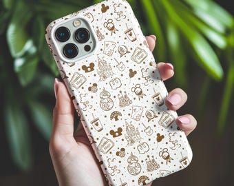 May include: White iPhone case with a brown and white pattern of Disney characters and icons. The case features Mickey Mouse, Minnie Mouse, Cinderella's Castle, and other Disney-themed imagery. The text "Magic" appears multiple times on the case.