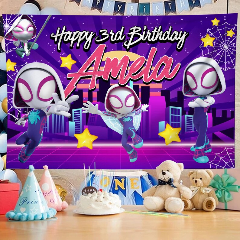 May include: A birthday banner with the text "Happy 3rd Birthday Amela" featuring cartoon characters in a cityscape background. The banner is purple, pink, and white with yellow stars and spiderwebs.
