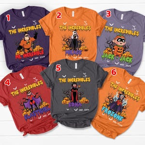 May include: Six short-sleeve t-shirts in purple, orange, and red featuring The Incredibles characters in Halloween costumes. Each shirt displays a character name, the text The Incredibles, Est. 2004, and a graphic of pumpkins and bare trees.