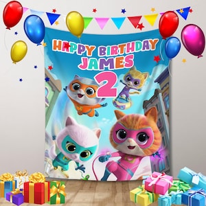 May include: A colorful birthday banner with the words "Happy Birthday James" and the number "2" in pink. The banner features cartoon characters from the show "PAW Patrol" with a blue, green, and pink color scheme.
