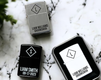 May include: Three silver lighters with personalized engravings. The lighters are engraved with the names Liam Williams, Liam Smith, and Liam Williams. The first two lighters are in a silver finish, while the third lighter is in a white finish. The lighters are all engraved with a diamond shape containing the letter L.