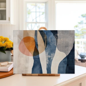 May include: Abstract art print with blue, beige, and orange shapes on a white background.