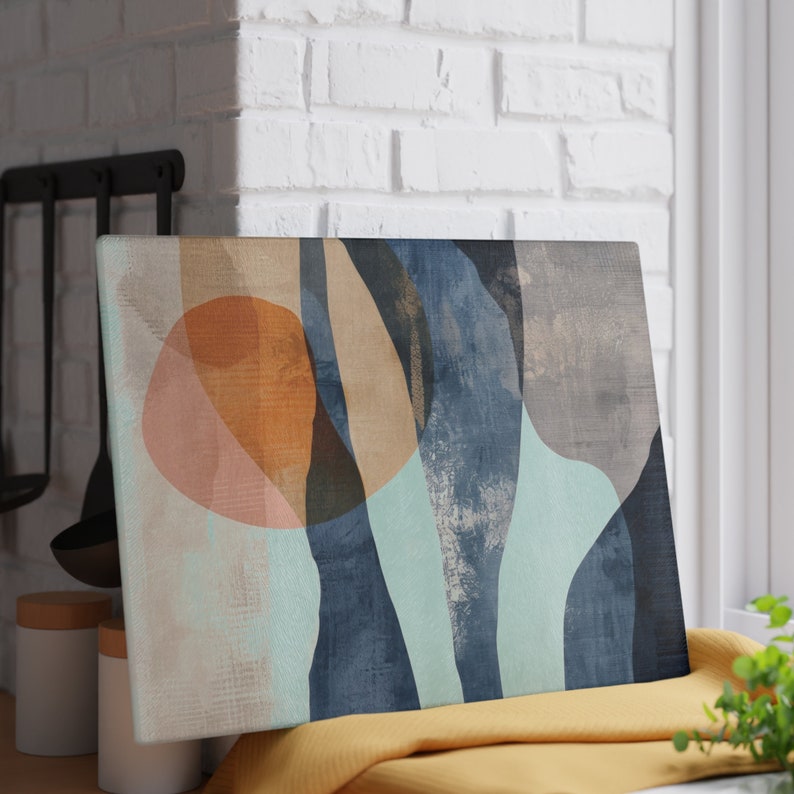 May include: Abstract art print with a blue, green, and beige color scheme. The print features overlapping shapes and a textured background.