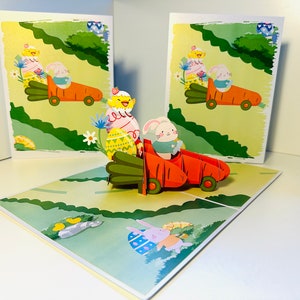 Carte de voeux pop-up 3D Lapin de Pâques dans une voiture aux carottes fait main avec amour Cartes pop origami - ACHETER EN LIGNE https://origamipopcards.com/