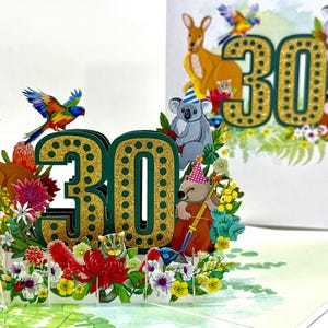 May include: A 3D birthday card with the number 30, decorated with Australian wildlife and flora. The card features kangaroos, koalas, and parrots, with musical instruments and a floral arrangement.