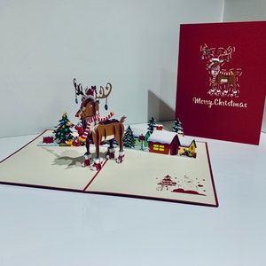 Cartão "Rudolph, a Rena do Nariz Vermelho" criado por Origami Pop Cards, Sydney, Austrália. Cartões Pop-up de Papel 3D OrigamiPopCards.com