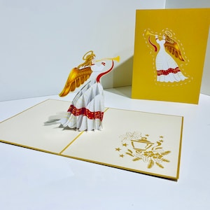 Anjo de Natal tocando trombeta ~ Cartão de felicitações pop-up 3D feito à mão com amor Compre online https://origamipopcards.com/