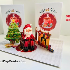 Tome uma xícara de chá ou café com o Papai Noel. Cartão de Feliz Natal 3D Pop-up. Compre online https://origamipopcards.com/ Com amor.