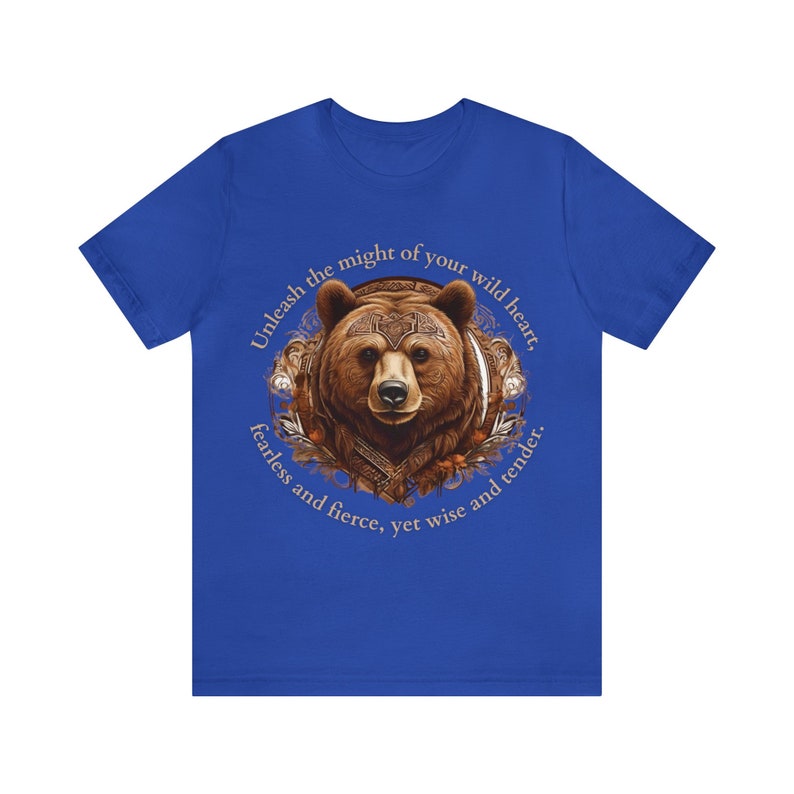 May include: A blue t-shirt with a brown bear illustration and the text "Unleash the might of your wild heart, fearless and fierce, yet wise and tender."
