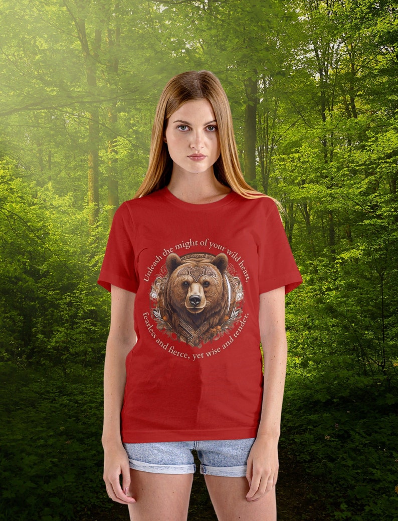 May include: Red t-shirt with a brown bear graphic and the text "Unleash the might of your wild heart. Fearless and fierce, yet wise and tender."