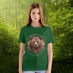 May include: Green t-shirt with a brown bear illustration and the text "Unleash the might of your wild heart, fearless and fierce, yet wise and tender."