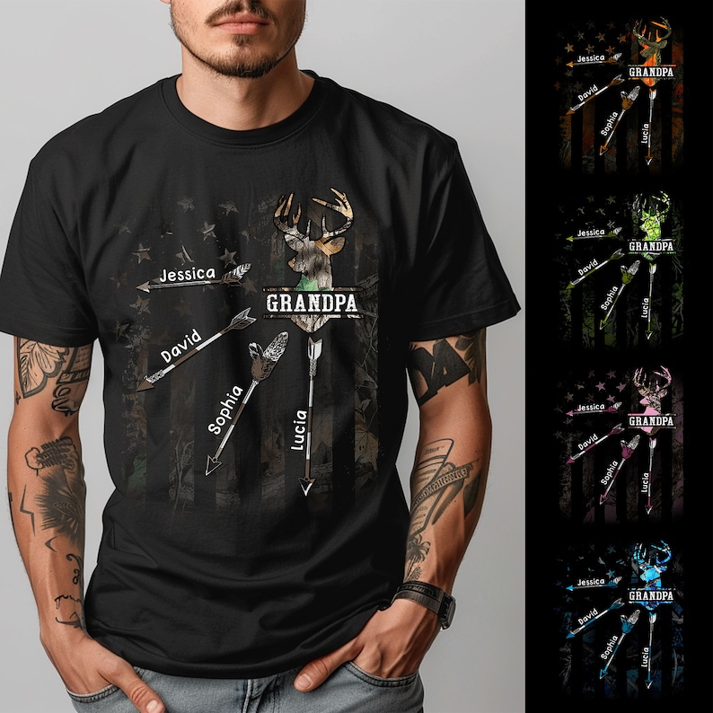 May include: Black t-shirt with a camouflage pattern and a deer silhouette. The text "GRANDPA" is printed above the deer, and the names "Jessica", "David", "Sophia", and "Lucia" are printed on arrows pointing towards the deer.