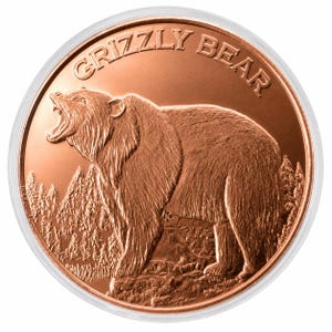 May include: A round copper-colored coin featuring a relief of a roaring grizzly bear standing in a forest. The text GRIZZLY BEAR is embossed along the upper edge of the coin. The coin is encased in a clear, circular protective plastic capsule.