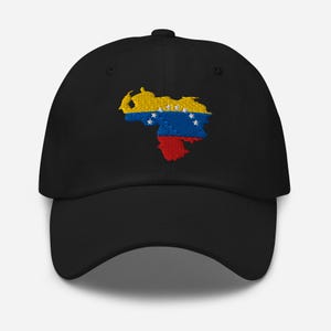 May include: Black baseball cap with an embroidered Venezuelan flag design. The flag is shaped like the country, with yellow, blue, red, and white star details. The cap has a curved peak and an adjustable strap at the back.