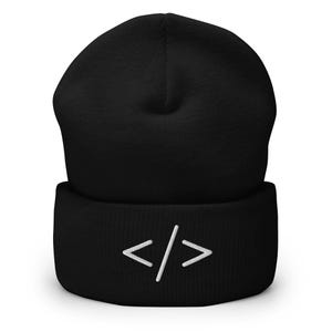 May include: Black beanie hat featuring a white embroidered coding symbol. The hat is made of a soft, knitted material with a folded cuff. The design is simple and modern, suitable for everyday wear.
